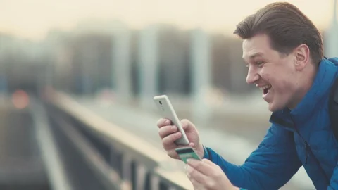 A man makes an online purchase using a smartphone. Stock Footage 88299432