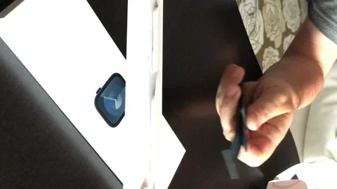 The man makes the open smart watch of the Apple Watch Series 9. Outdoing th.. Stock Footage 279738558