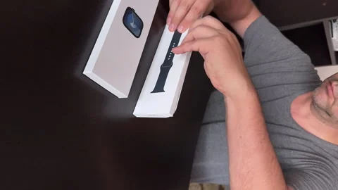 The man makes the open -smart watch of the Apple Watch Series 9. Outdoing t.. Stock Footage 279741435
