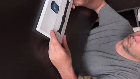 The man makes the open -smart watch of the Apple Watch Series 9. Outdoing the bo Stock Footage 279741488