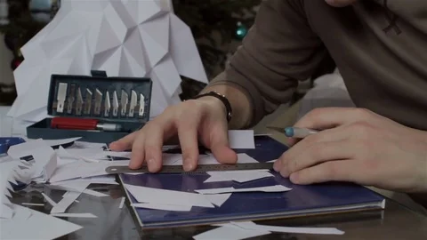 Man makes paper wolf's head Video stock 72750880