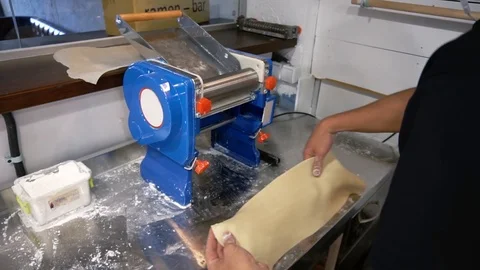 Man makes pasta in a restaurant Stock Footage 122703053