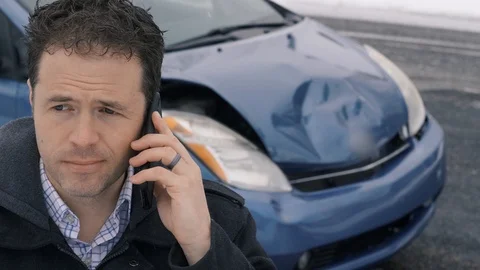 Man makes phone call after car accident camera move left to right Stock-Footage 104701484