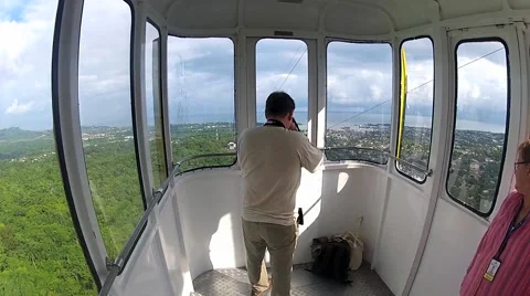 Man makes photo from the moving cable car gondola. Stock Footage 58357009