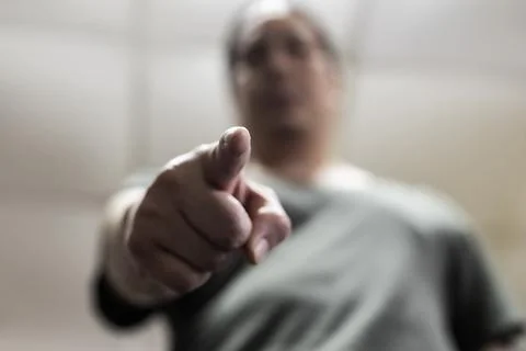 A man makes a pointing gesture. Stock Photos