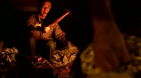 Man makes popcorn at night, using the traditional Chinese process Stock Footage 57840219