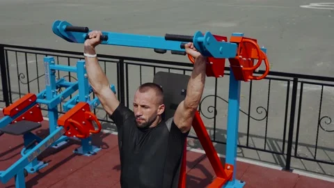 A man makes a press sitting on the simulator. Sports. Stock Footage 135205616