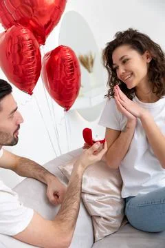 Man makes a proposal with the engagement ring at the Valentines day celebration Stock Photos