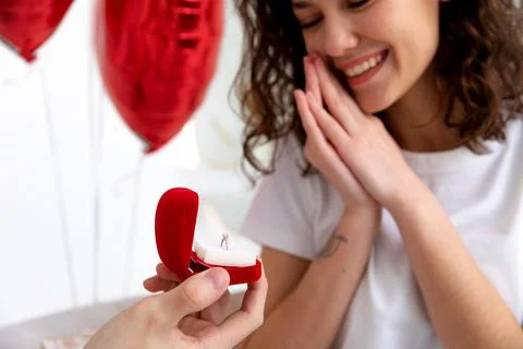 Man makes a proposal with the engagement ring at the Valentines day celebration Stock Photos