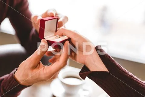 The man makes a proposal to his girlfriend Stock Photos