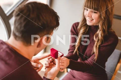 The man makes a proposal to his happy girlfriend Stock Photos