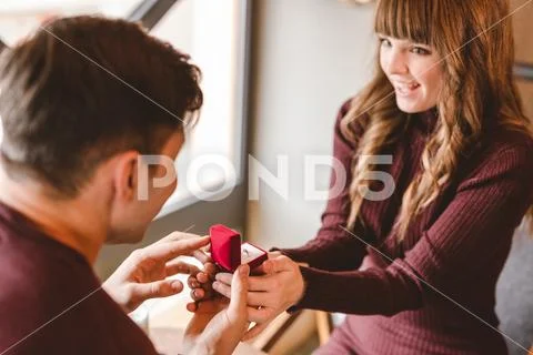 The man makes a proposal to his happy girlfriend Stock Photos