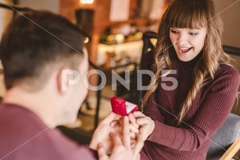 The man makes a proposal to his happy girlfriend Stock Photos