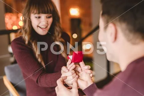 The man makes a proposal to his happy girlfriend Stock Photos