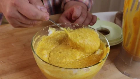 A man makes pumpkin filling to make pumpkin pie. Stock Footage 286110117