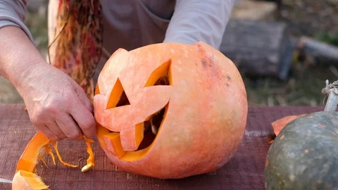 Man makes pumpkin for Halloween. Stock Footage 118352812