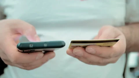 Man makes purchase in internet on-line stores use plastic credit card and Video stock 229886894