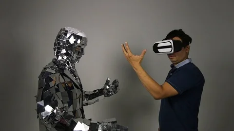 A man makes a robot copy his movements. Video stock 92946834