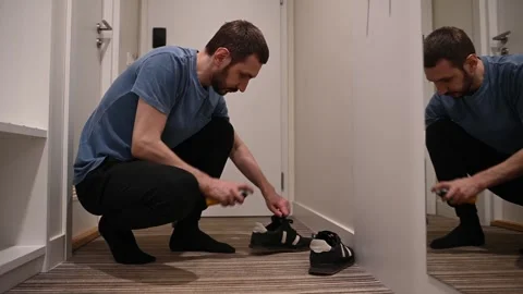 Man makes shoe care spray deodorant for shoes odorless shoe deodorant Stock Footage 307666306