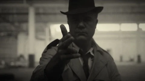 Man makes shooting gesture with hands and winks at camera Stock Footage 275643395