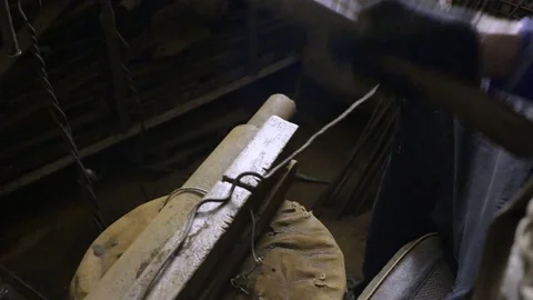 The man makes a smooth rebar . Preparation of materials for the Foundation, fenc Stock Footage 83073736