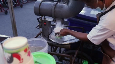 Man Makes Thai Shaved Ice Dessert, Pours Red Sweet Syrup Sauce, Street Food Stock-Footage 229600454