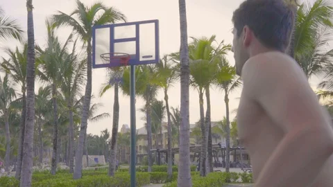 Man Makes Three Point Shot, Tropical Court Basketball on the Beach Video stock 116629484