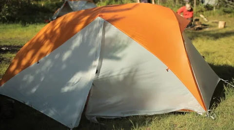 Man makes touch tablet out of the tent. Open the tent, touch tablet's screen and Stock Footage 64478025