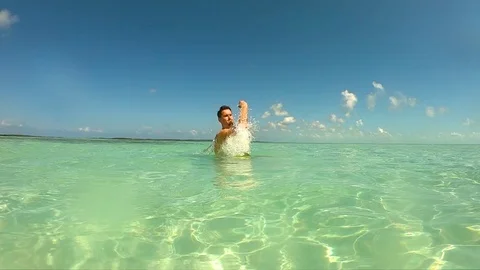 Man makes a turn around with the splashes before diving GoPro Hero7 Stock Footage 109100653