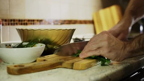 A man makes a vegetable salad Stock Footage 309669747