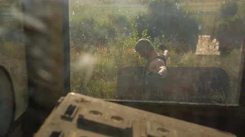 A man makes a warm-up before training at the abandoned construction site. Shot Stockbeeldmateriaal 79482772