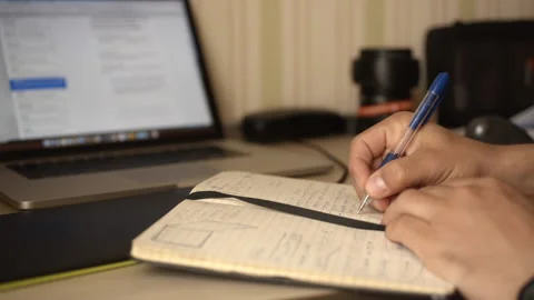 Man makes working entry in his diary 스톡 동영상 220076465