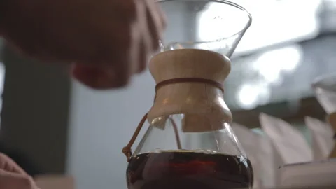 Man making alternative specialty filter coffee in pour over, brewing, minimal Video stock 221261879