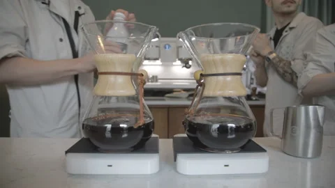 Man making alternative specialty filter coffee in pour over, brewing, minimal Stock Footage 221261958