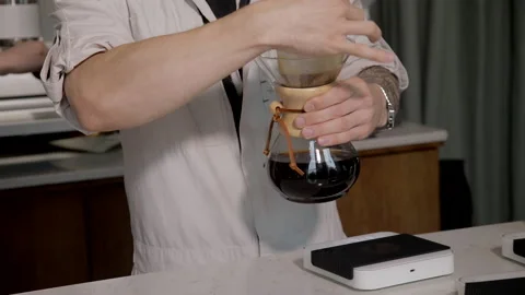 Man making alternative specialty filter coffee in pour over, brewing, minimal 스톡 동영상 221262002