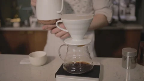 Man making alternative specialty filter coffee in pour over, brewing, minimal Stock Footage 221262017