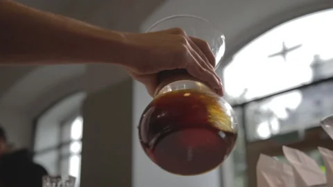Man making alternative specialty filter coffee in pour over, brewing, minimal Stock Footage 221262062