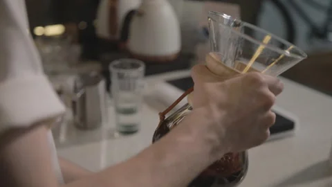 Man making alternative specialty filter coffee in pour over, brewing, minimal 스톡 동영상 221262079