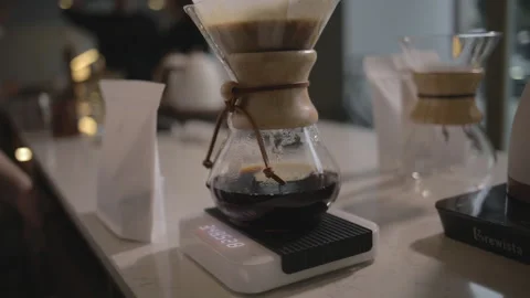 Man making alternative specialty filter coffee in pour over, brewing, minimal Stock Footage 234939050