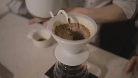 Man making alternative specialty filter coffee in pour over, brewing, minimal 스톡 동영상 234939196