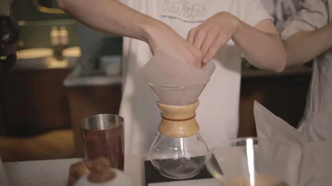 Man making alternative specialty filter coffee in pour over, brewing, minimal Video stock 241189251