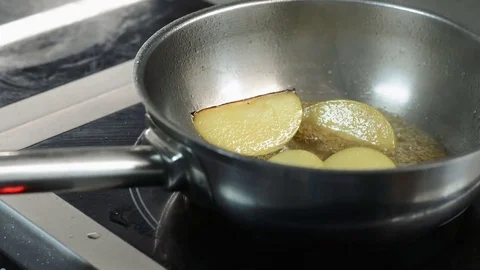 Man making apple pie. Cook puts apple slices into baking pan. Closeup. Making Stock Footage 73132483
