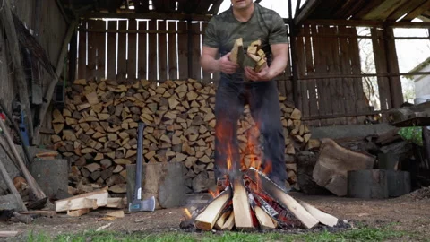 Man making barbecue fire Stock Footage 154395291