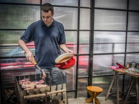 A Man Making Barbecue Stock Photos
