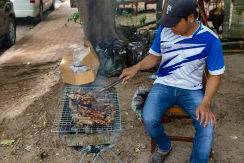 Man making BBQ Stock Photos