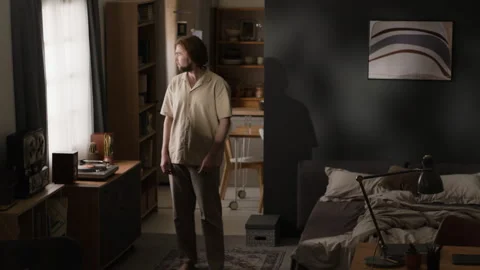 Man Making Bed during Daily Morning Routine in Apartment Stock Footage 345516805