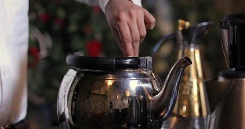 A man making black tea and pouring black tea to the teapot Stock Footage 146718725