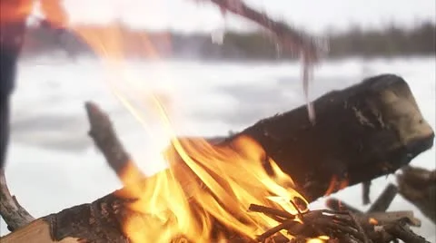 A man making a bonfire in the winter Stock Footage 11333167