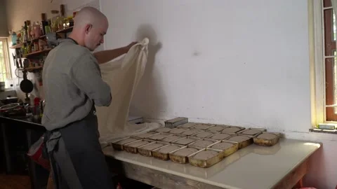 A man is making bread on the kitchen. 動画素材 236929182