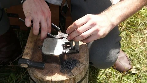 Man making chain armor, blacksmith Stock Footage 78932444